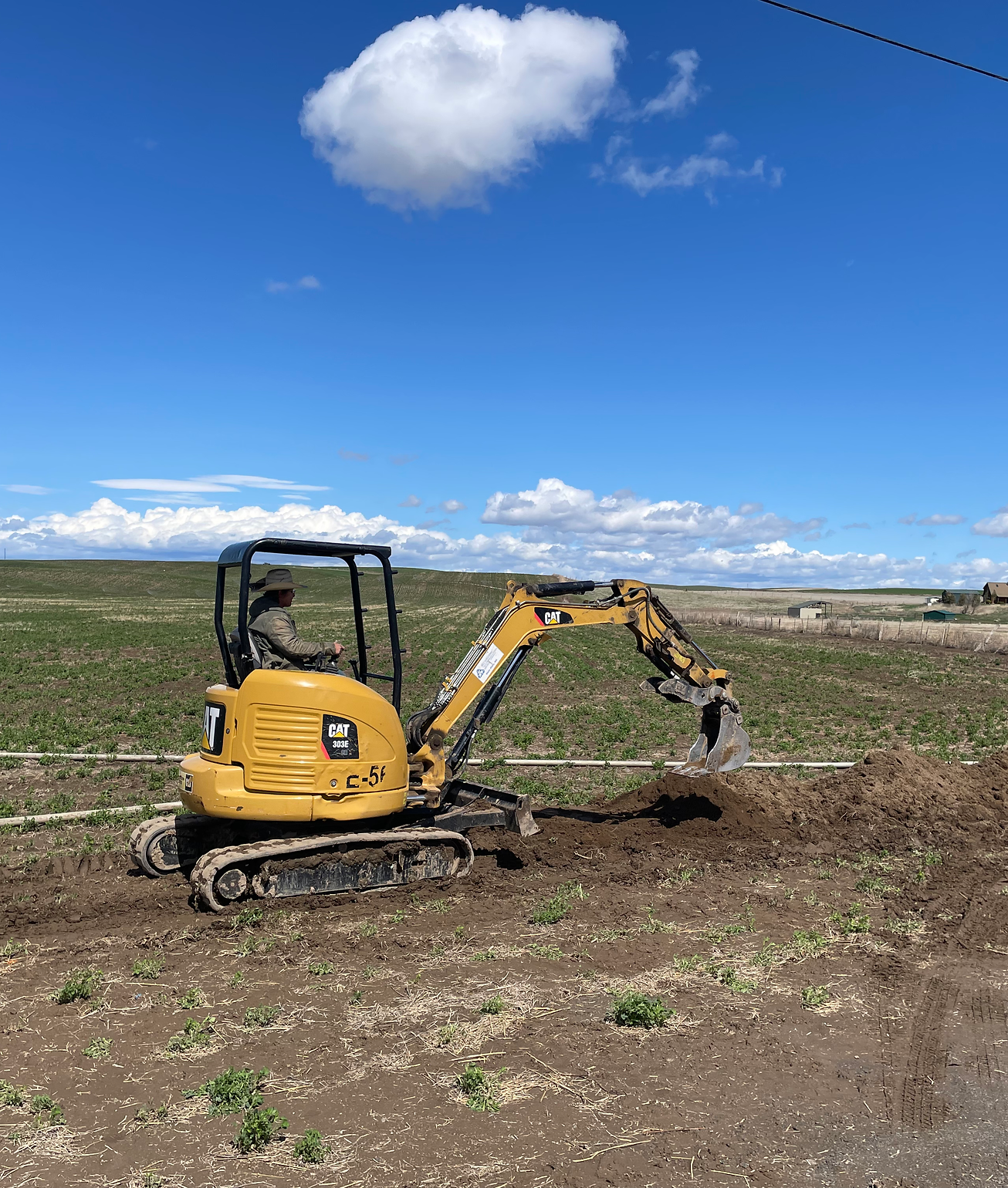 Excavator working in a field